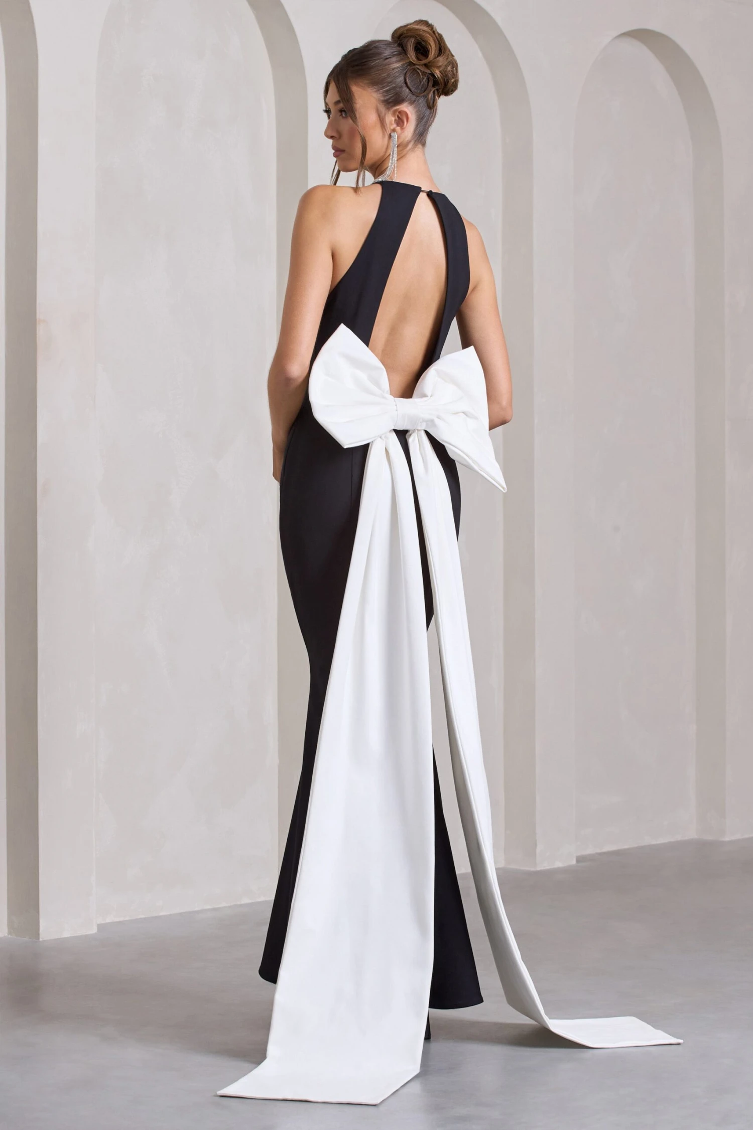 Bestow | Black Open-Back Maxi Dress With Oversized White Bow 1 Bestow | Black Open-Back Maxi Dress With Oversized White Bow